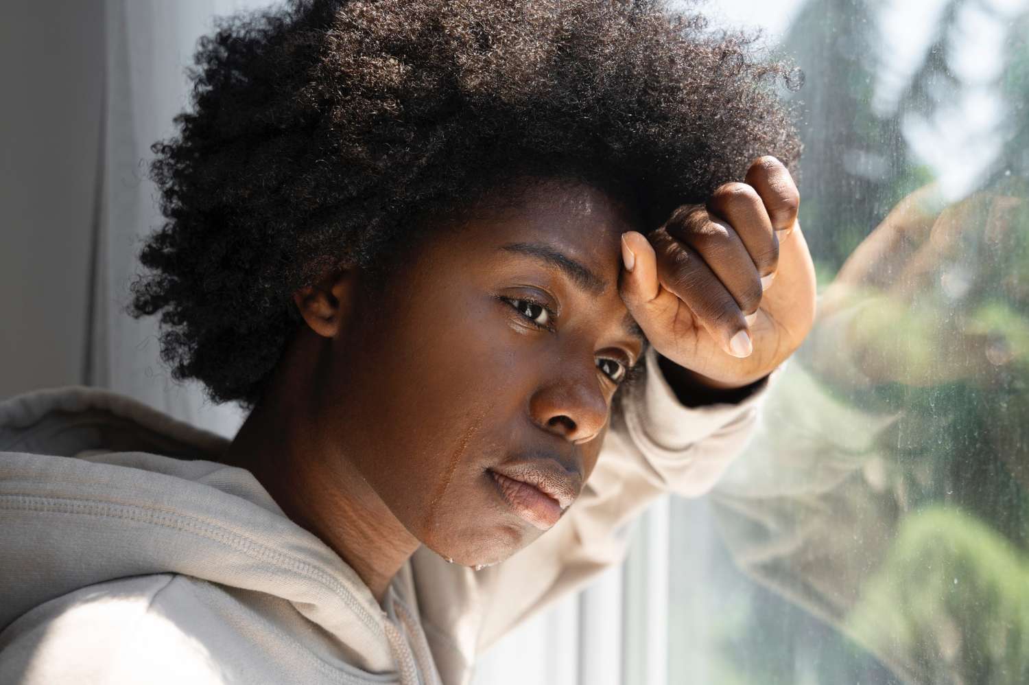 A woman going through stressful times and crying.